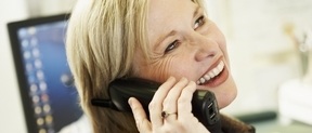 Woman using PABX / VoIP telephone systems